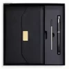executive-black-leatherette-journal-pen-gift-set.jpg Luxury black leatherette journal set with a magnetic gold flap closure, metal rollerball pen, and extra ink refill inside a black presentation box.