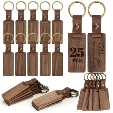 Rectangular blank wooden keychains with leather straps and metal key rings for DIY laser engraving and crafting.
