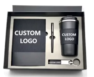 matte-black-executive-corporate-gift-set-custom-logo.jpg Luxury matte black executive corporate gift set featuring a travel tumbler, notebook, metal pen, and keychain with custom logo placeholders in a presentation box.