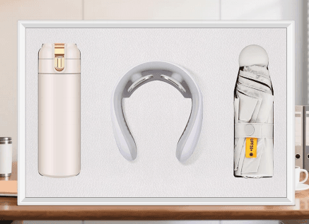 smart-wellness-gift-set-neck-massager-flask-umbrella.jpg Luxury smart wellness gift set featuring a cream electric neck massager, insulated thermos flask with gold clasp, and a compact UV umbrella in a white presentation box.
