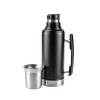 Black Stainless Steel Thermos Flask with Side Handle and Stainless Steel Cup Black stainless steel thermos flask with a side handle, featuring a black pour spout and an unattached stainless steel cup resting beside it against a plain white background.