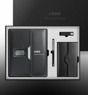 Premium Black Executive Corporate Gift Set Black executive corporate gift set in an open presentation box, including a leather-bound notebook with an embedded digital clock display, a sleek ballpoint pen, a USB flash drive, and a small leather wallet or card holder.
