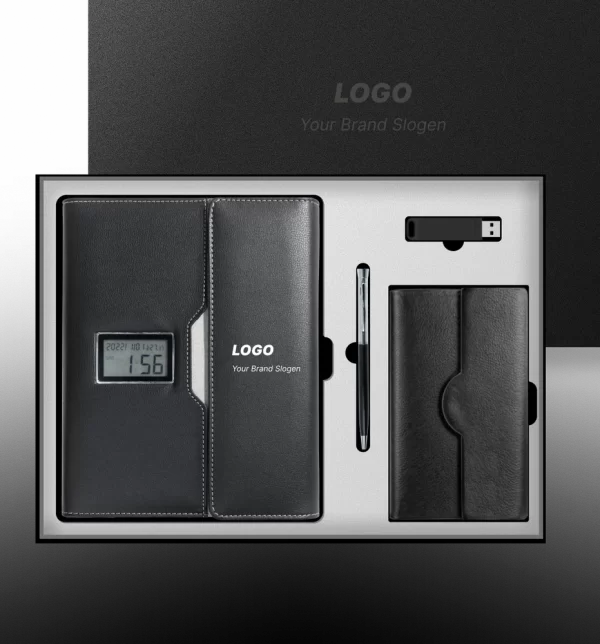 Black executive corporate gift set in an open presentation box, including a leather-bound notebook with an embedded digital clock display, a sleek ballpoint pen, a USB flash drive, and a small leather wallet or card holder.